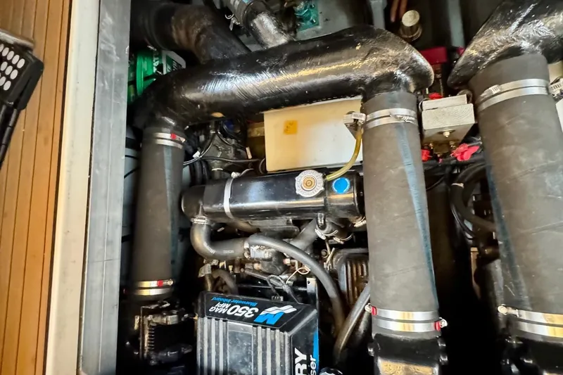 Slide: The Image of Engine compartment of a 2000 Sea Ray 310 Sundancer boat, featuring Mercury 350 engine. - 39
