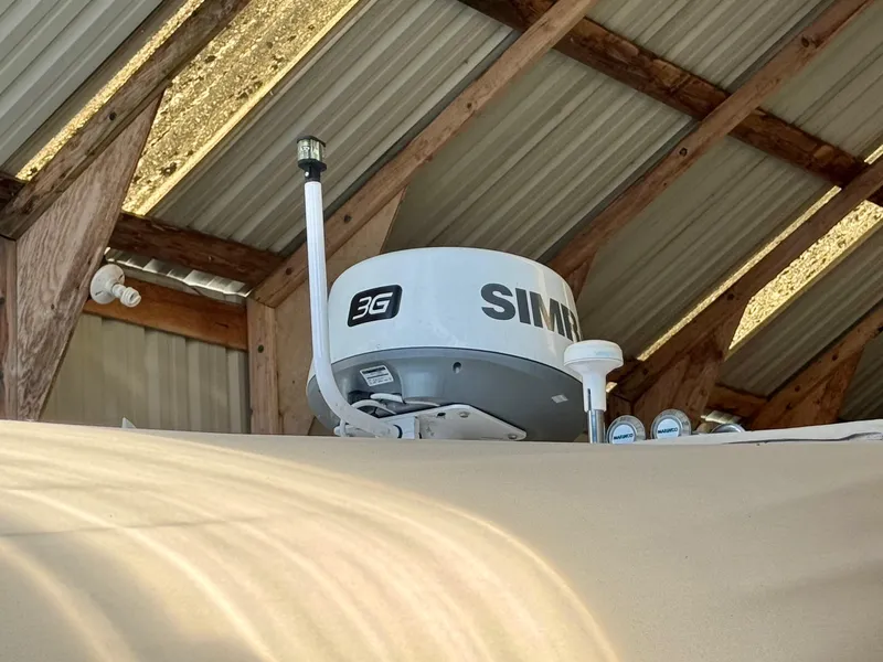 Slide: The Image of Radar equipment on a 2000 Sea Ray 310 Sundancer under a metal roof. - 7