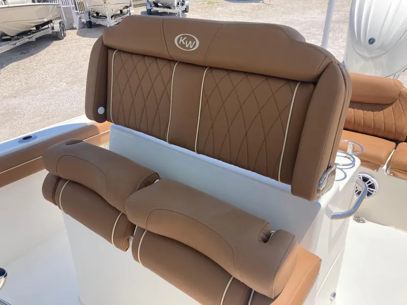 Slide: The Image of 2025 Key West 239FS boat seat with brown cushioned upholstery and diamond stitching. - 16