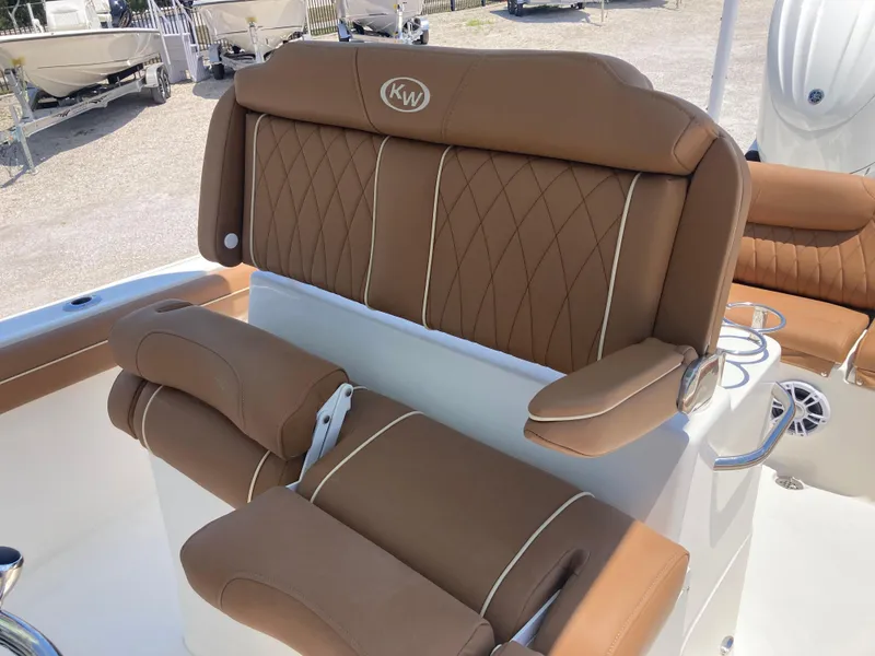 Slide: The Image of 2025 Key West 239FS boat with luxurious brown seating and diamond stitching. - 17