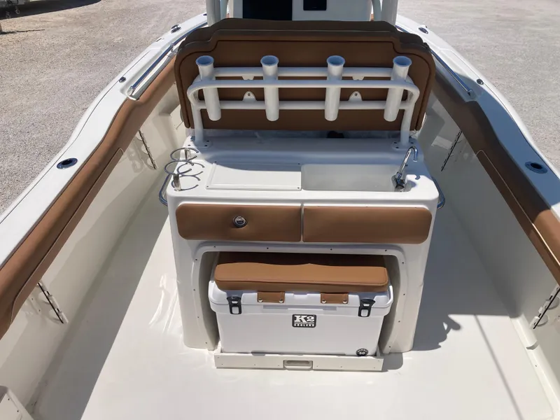 Slide: The Image of 2025 Key West 239FS boat interior with rod holders and cooler. - 5
