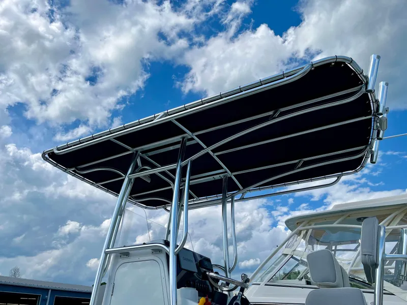 Slide: The Image of 2022 Parker 2100 Special Edition boat with T-top against a cloudy sky. - 3