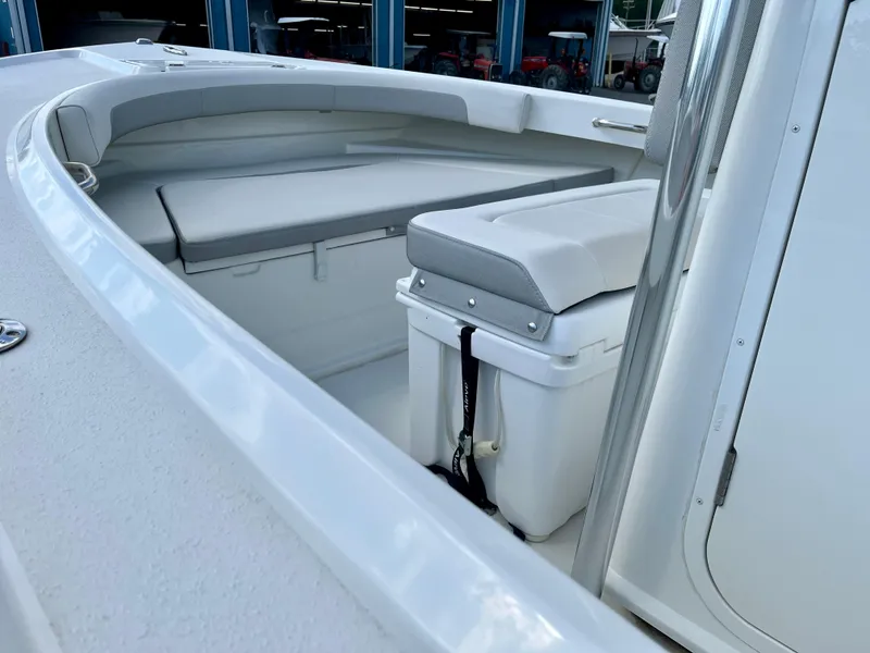 Slide: The Image of 2022 Parker 2100 Special Edition boat interior with cushioned seating and storage. - 7