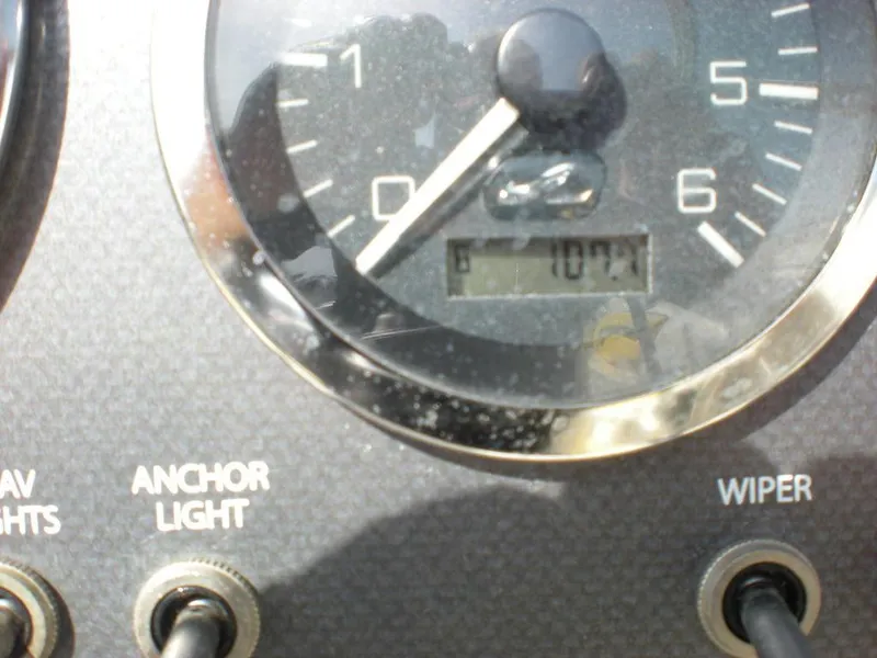 Slide: The Image of Close-up of 2006 Sea Ray 210 Sport dashboard with gauge and switches. - 2