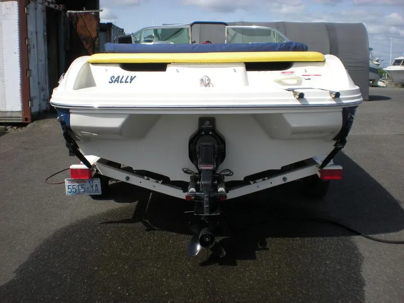 Slide: The Image of 2006 Sea Ray 210 Sport boat, rear view, parked on a trailer. - 5