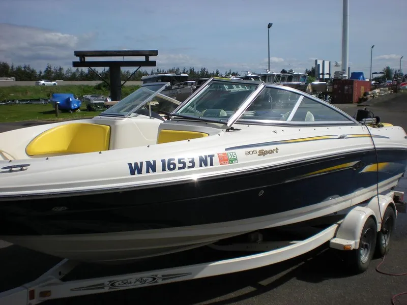 Slide: The Image of 2006 Sea Ray 210 Sport boat on trailer, parked outdoors. - 6