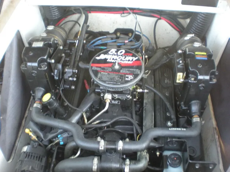 Slide: The Image of Engine of a 2006 Sea Ray 210 Sport boat, featuring a 5.0L Mercury motor. - 8