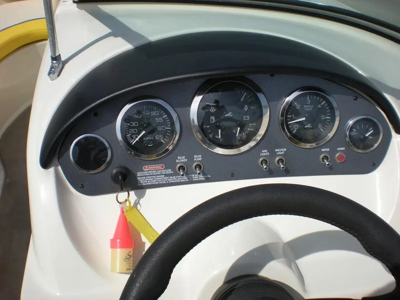 Slide: The Image of Dashboard of a 2006 Sea Ray 210 Sport boat with gauges and controls. - 9