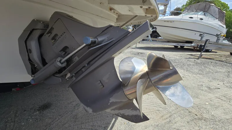 Slide: The Image of Crownline 262 EX 2006 boat propeller and stern drive on dry dock. - 11