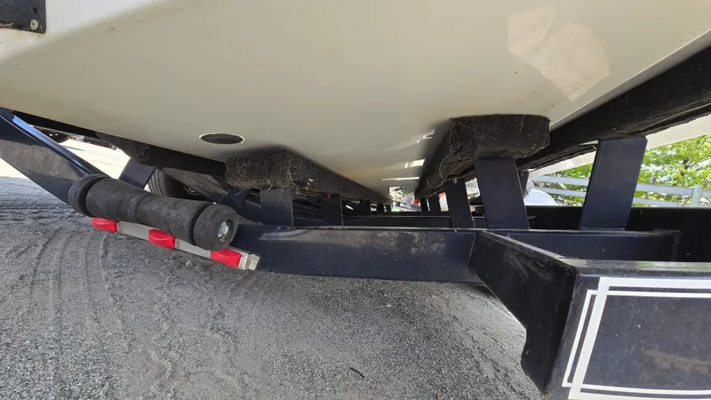 Slide: The Image of Underneath view of a 2006 Crownline 262 EX boat on a trailer. - 12