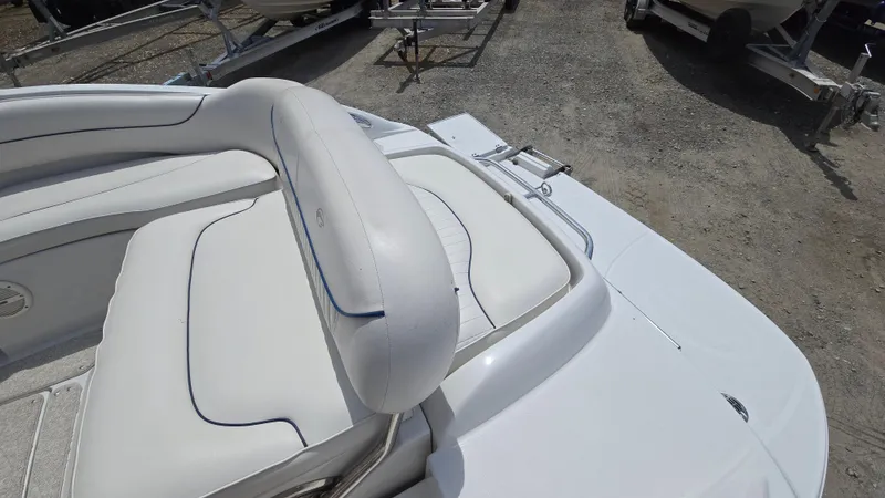 Slide: The Image of 2006 Crownline 262 EX boat with white seating and sleek design. - 27