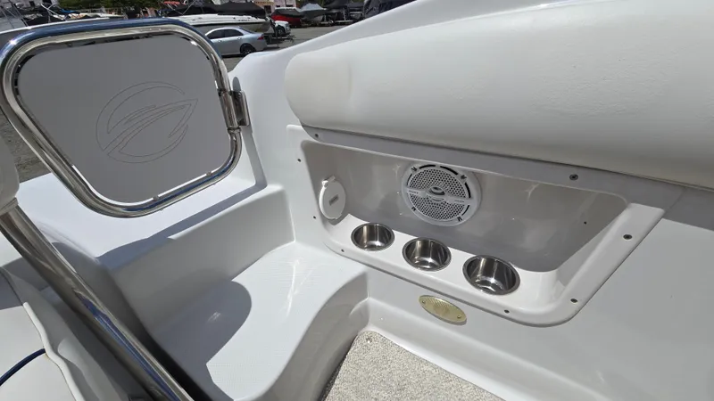 Slide: The Image of 2006 Crownline 262 EX boat interior with cup holders and speaker. - 34