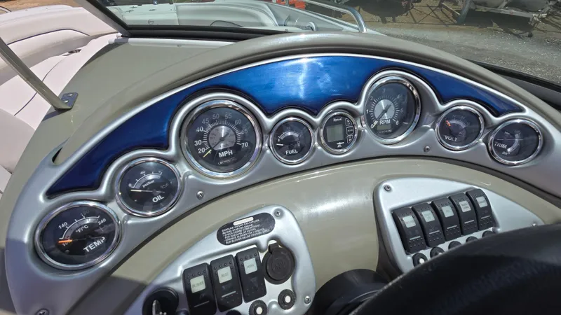 Slide: The Image of Dashboard of a 2006 Crownline 262 EX boat with gauges and controls. - 37