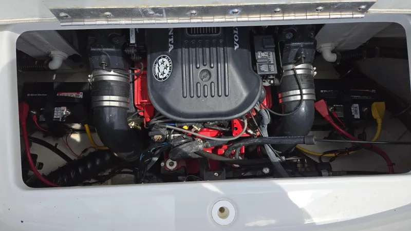 Slide: The Image of Engine compartment of a 2006 Crownline 262 EX boat, showcasing detailed mechanical components. - 45