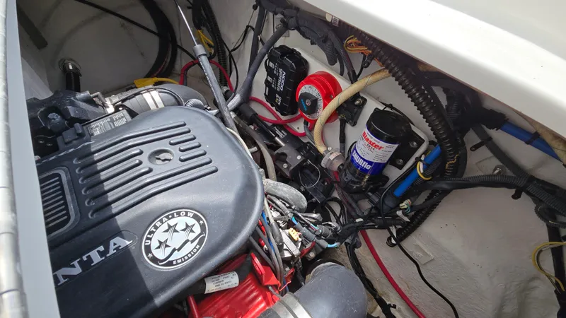 Slide: The Image of Engine compartment of a 2006 Crownline 262 EX boat, featuring Volvo Penta components. - 46