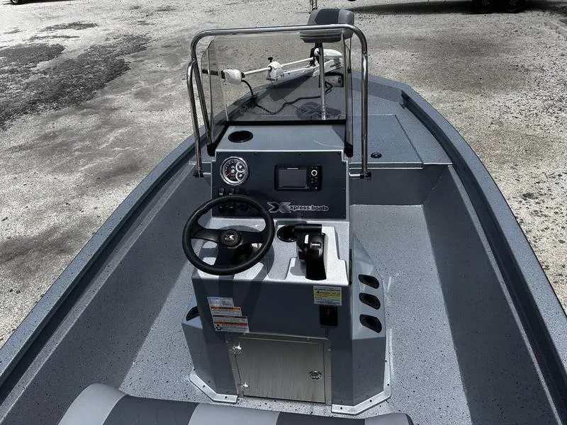 Slide: The Image of 2025 Xpress H190B boat interior with steering console and controls. - 12