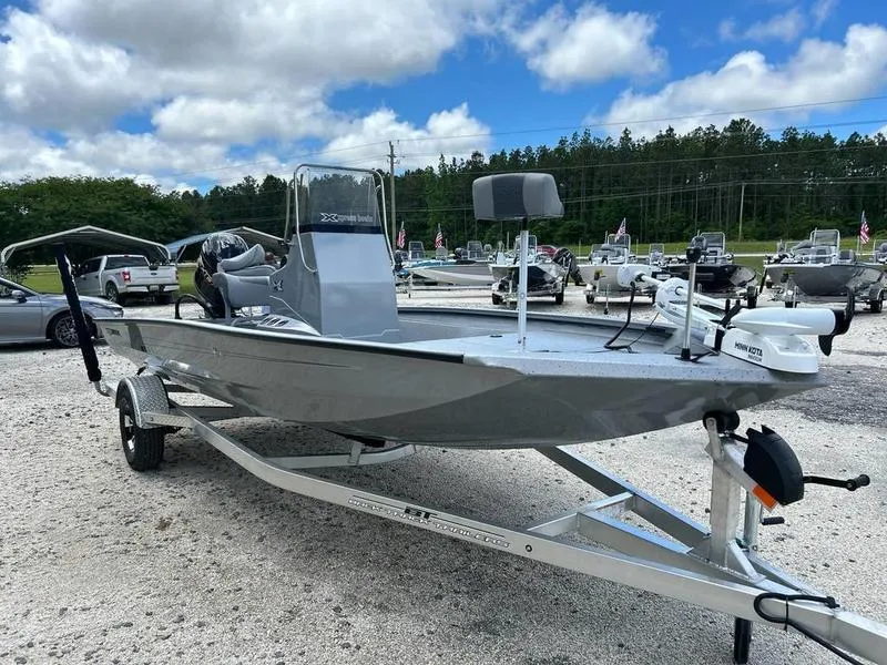 Slide: The Image of 2025 Xpress H190B boat on trailer, parked outdoors under cloudy sky. - 5
