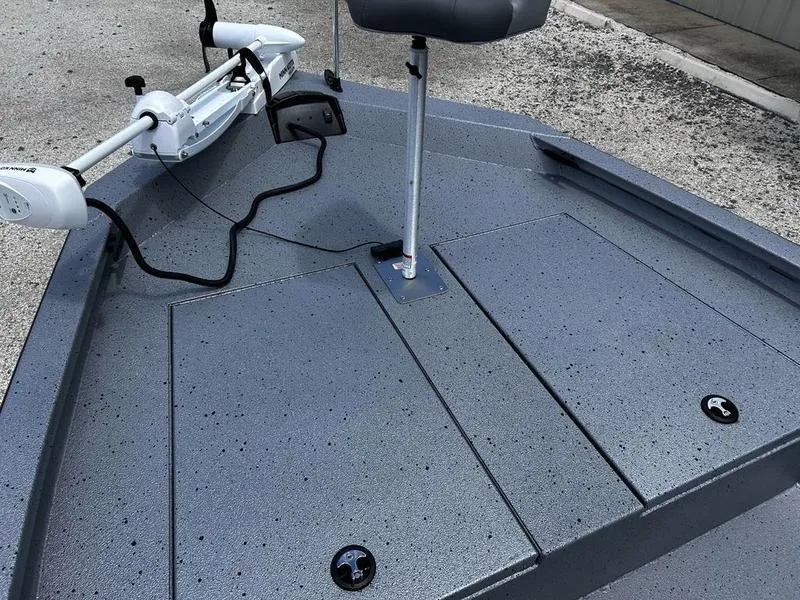 Slide: The Image of 2025 Xpress H190B boat deck with trolling motor and storage compartments. - 7