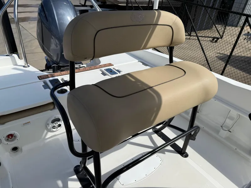 Slide: The Image of 2019 NauticStar 231 Hybrid boat seat with beige upholstery and black frame. - 17