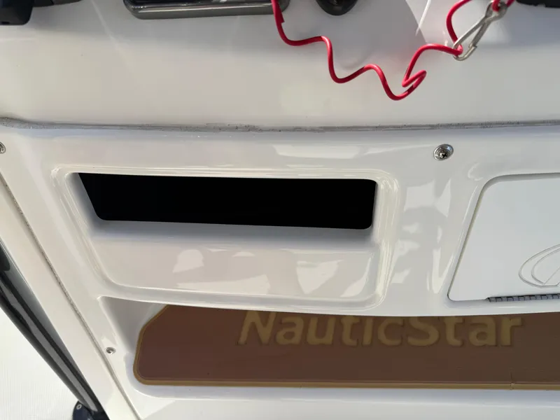Slide: The Image of 2019 NauticStar 231 Hybrid boat dashboard with red safety cord. - 28