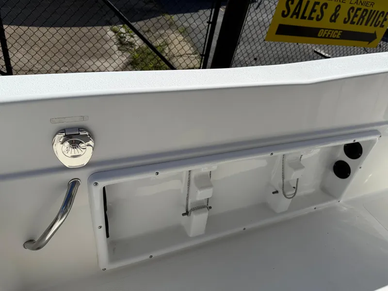 Slide: The Image of 2019 NauticStar 231 Hybrid boat interior with storage compartment and handle. - 31