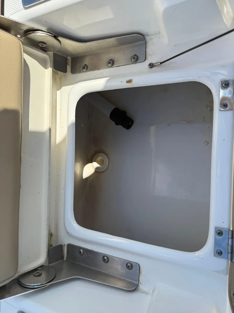 Slide: The Image of 2019 NauticStar 231 Hybrid boat storage compartment, open and empty. - 35