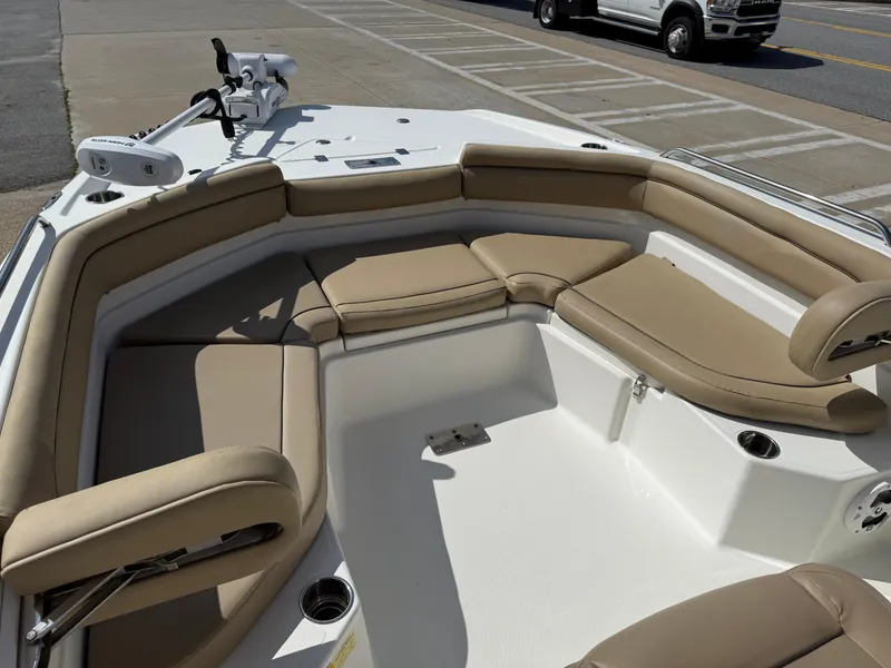 Slide: The Image of 2019 NauticStar 231 Hybrid boat with beige seating and spacious deck. - 8