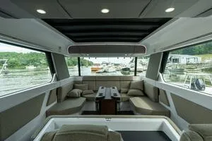 Slide: The Image of Interior of 2024 Axopar 45 boat, featuring spacious seating and modern design. - 11