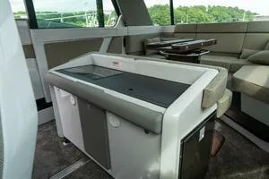 Slide: The Image of Interior of 2024 Axopar 45 boat featuring modern seating and sleek design. - 12