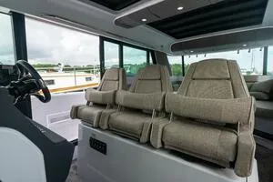 Slide: The Image of Interior of 2024 Axopar 45 XC Cross Cabin with modern helm and seating. - 10