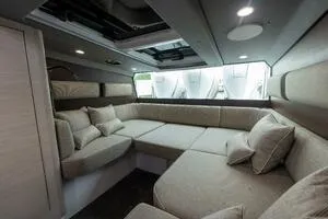 Slide: The Image of Luxurious interior of 2024 Axopar 45 XC Cross Cabin with modern seating and ambient lighting. - 18