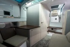 Slide: The Image of 2024 Axopar 45 XC Cross Cabin interior with modern seating and sleek design. - 20