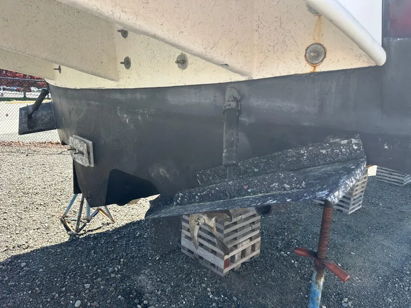 Slide: The Image of 2004 Sea Ray 360 Sundancer boat hull on dry dock, supported by blocks. - 10