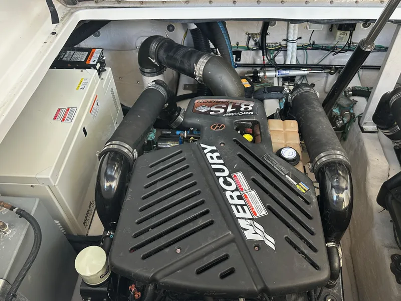 Slide: The Image of Engine compartment of a 2004 Sea Ray 360 Sundancer with Mercury components. - 21