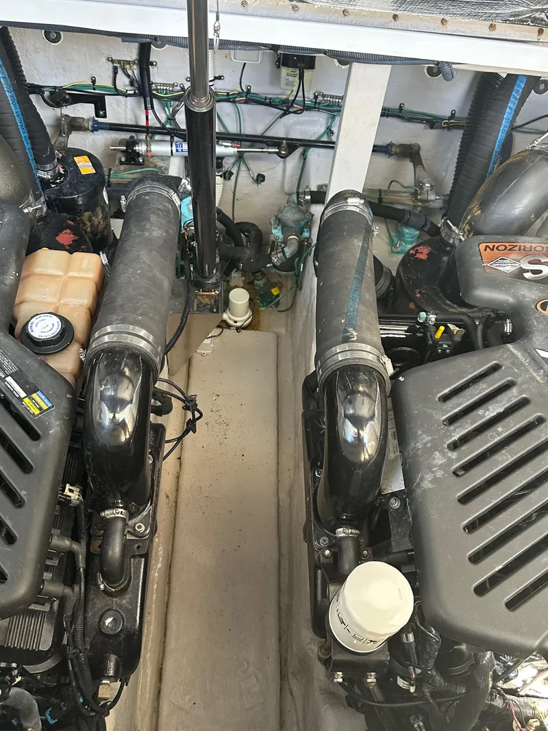 Slide: The Image of Engine room of a 2004 Sea Ray 360 Sundancer with visible components and wiring. - 22