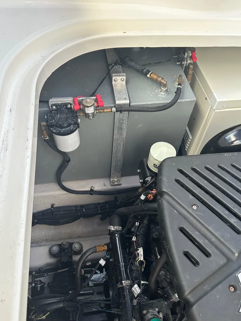 Slide: The Image of Engine compartment of a 2004 Sea Ray 360 Sundancer boat, showing mechanical components. - 27