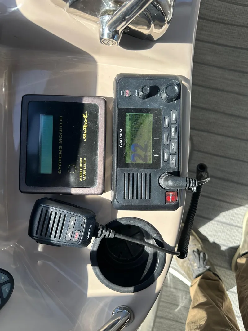 Slide: The Image of 2004 Sea Ray 360 Sundancer dashboard with Garmin navigation and communication equipment. - 41