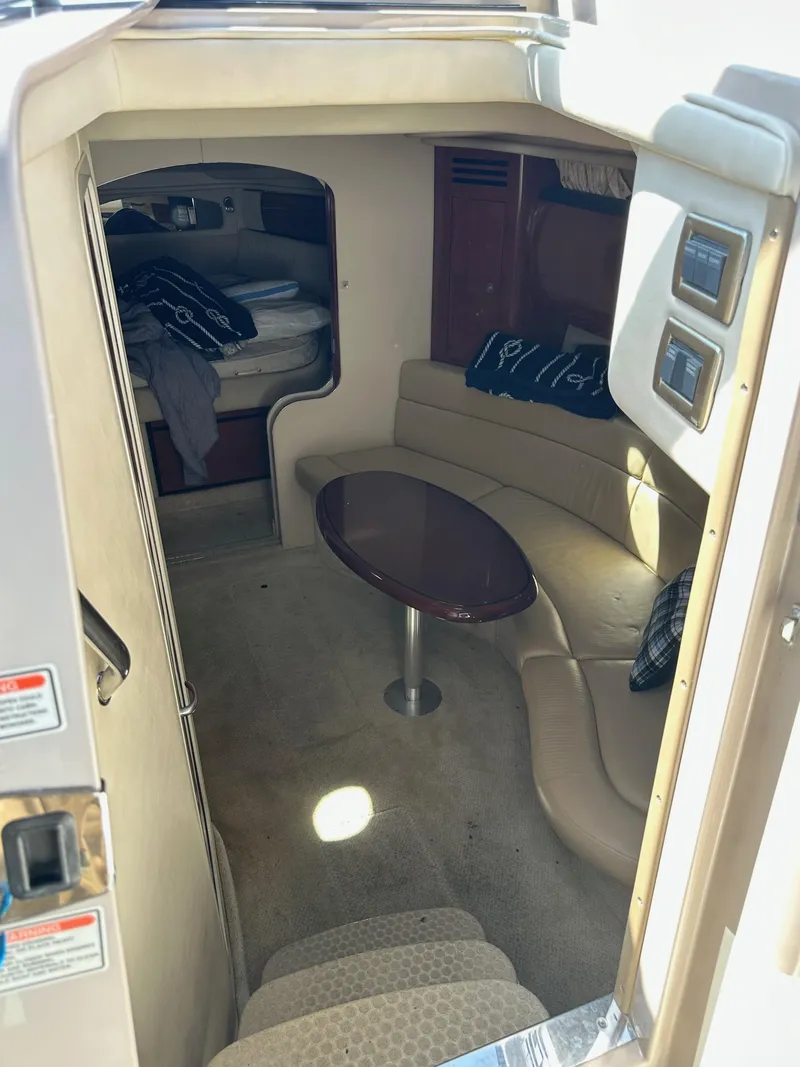 Slide: The Image of 2004 Sea Ray 360 Sundancer cabin interior with seating area and table. - 48