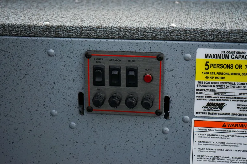 Slide: The Image of Control panel of 2025 Lund 1600 Fury Tiller boat with capacity warning label. - 10