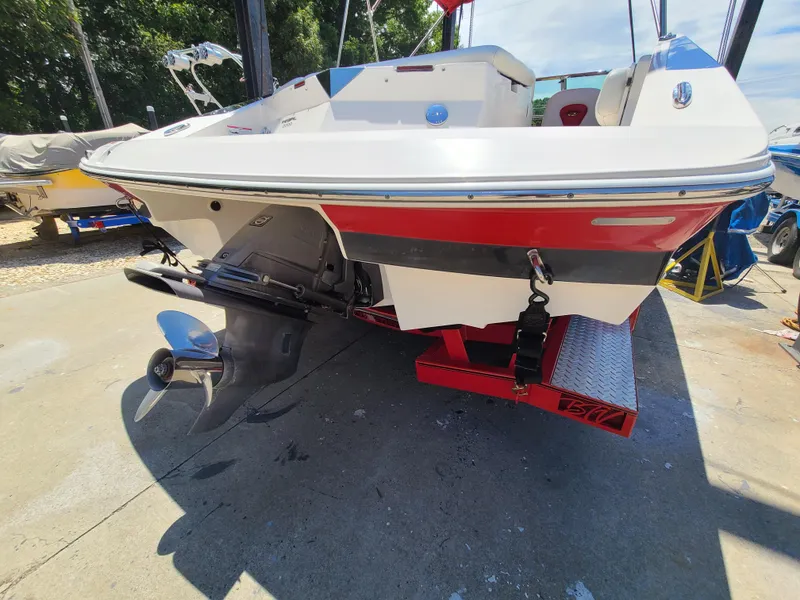 Slide: The Image of 2007 Regal 2200 Bowrider boat on trailer, rear view, with outboard motor. - 10