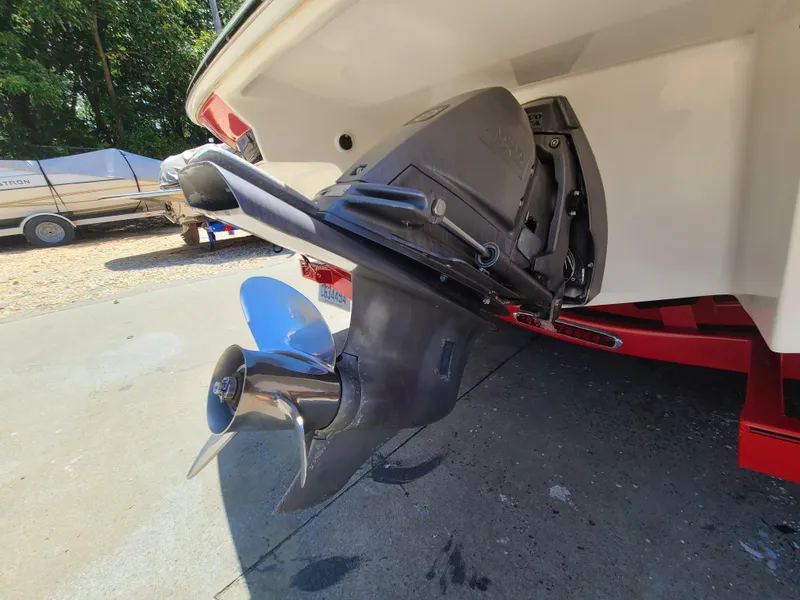 Slide: The Image of 2007 Regal 2200 Bowrider boat with visible outboard motor and propeller. - 16