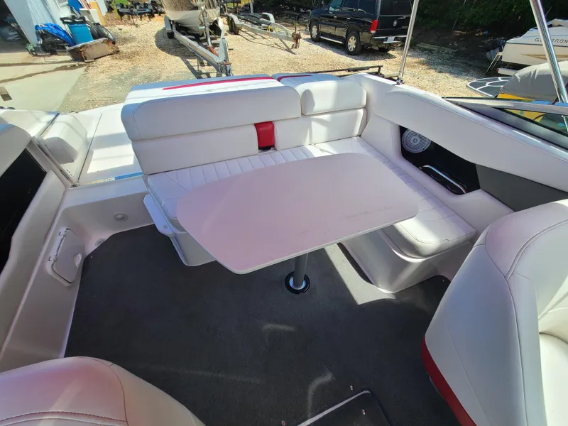 Slide: The Image of 2007 Regal 2200 Bowrider interior with seating and table setup. - 29