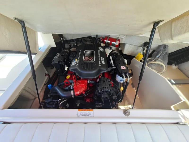 Slide: The Image of Engine compartment of a 2007 Regal 2200 Bowrider boat, showcasing a powerful engine. - 34