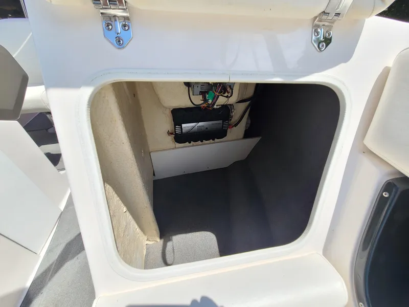Slide: The Image of Storage compartment in a 2007 Regal 2200 Bowrider boat, showing interior wiring. - 37