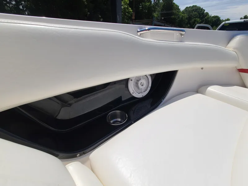 Slide: The Image of 2007 Regal 2200 Bowrider interior with white seating and built-in speaker. - 39