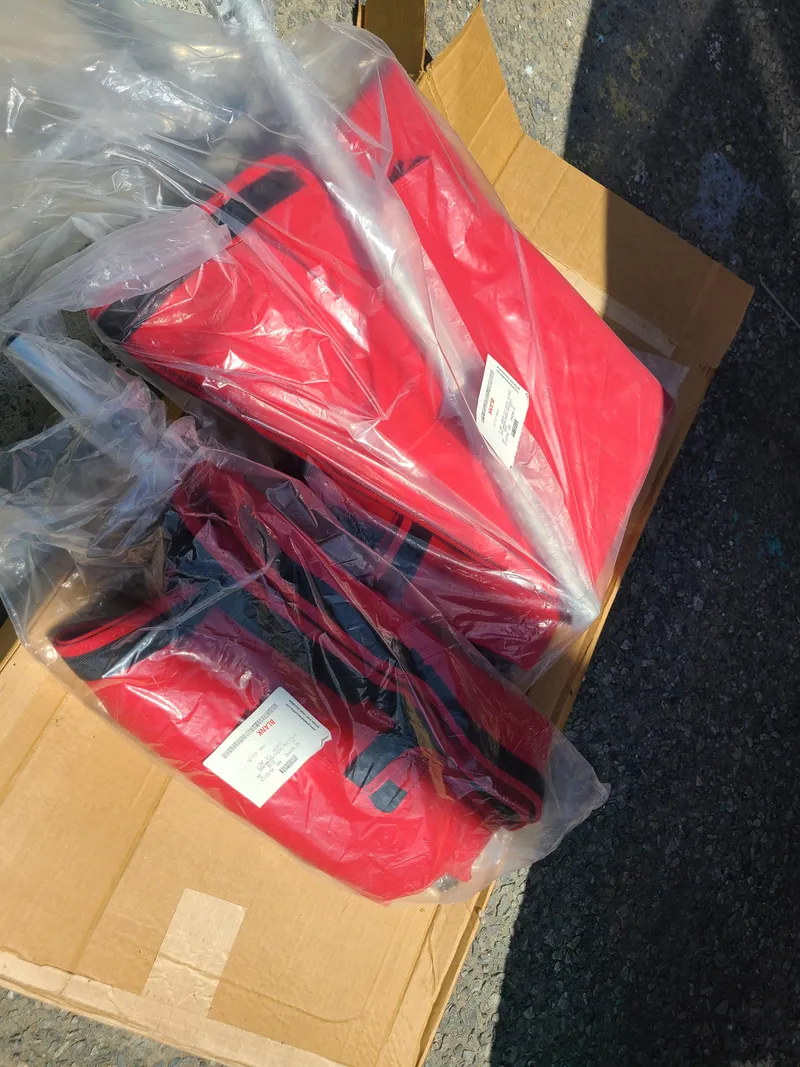 Slide: The Image of Red boat seat covers in packaging for 2007 Regal 2200 Bowrider. - 42