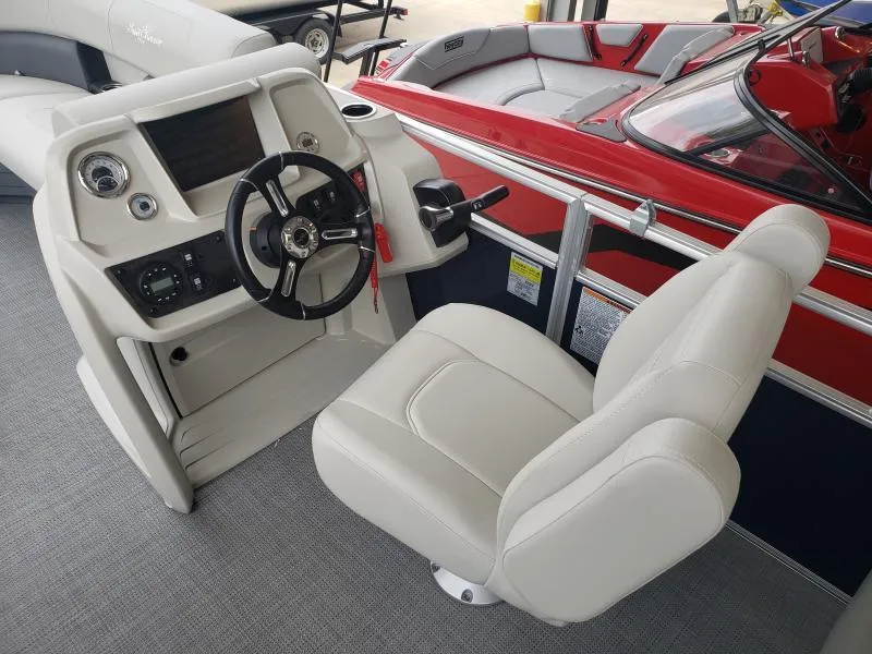 Slide: The Image of 2024 SunChaser Vista 22 LR boat interior with steering console and comfortable seating. - 11