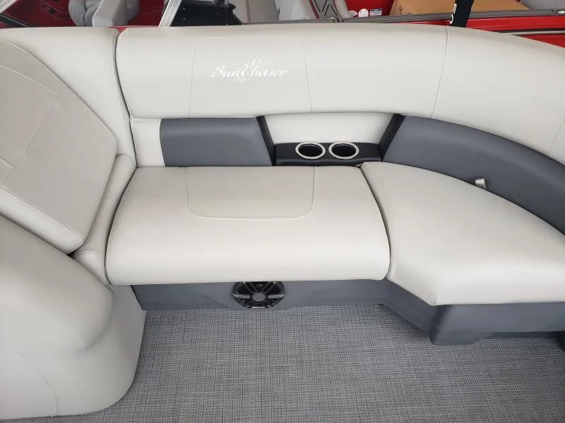 Slide: The Image of 2024 SunChaser Vista 22 LR boat seating with cup holders and speaker. - 16