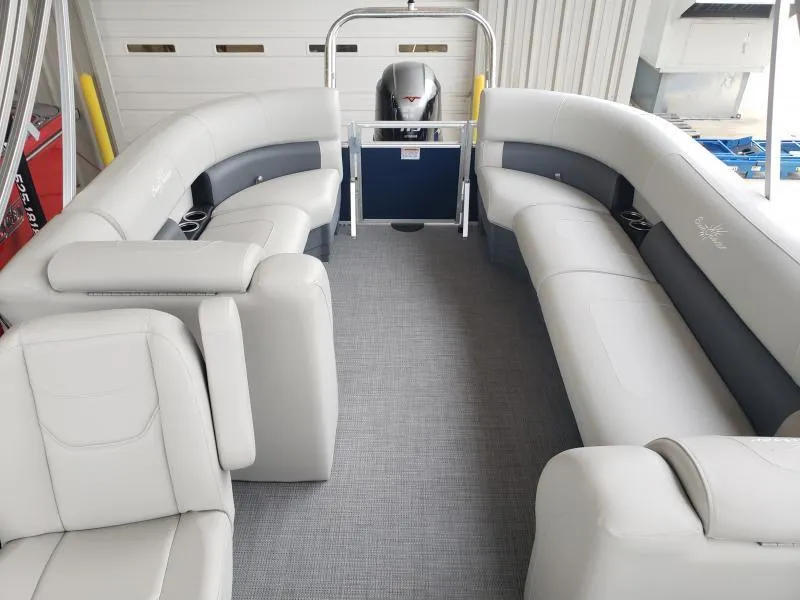 Slide: The Image of 2024 SunChaser Vista 22 LR pontoon boat interior with plush seating and modern design. - 17
