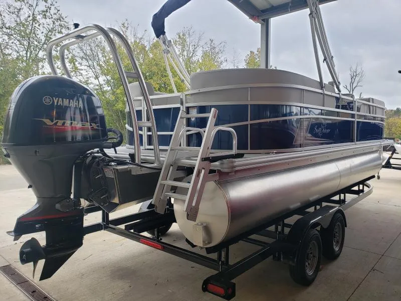 Slide: The Image of 2024 SunChaser Vista 22 LR pontoon boat with Yamaha outboard motor on trailer. - 5
